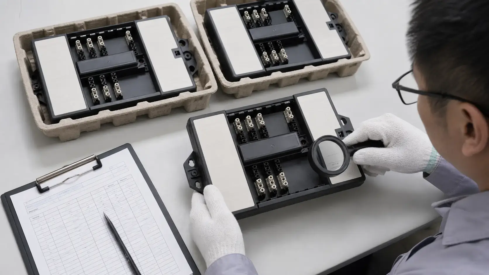 Inspector checking batch records for Connect UltraLite lighting control connection centres