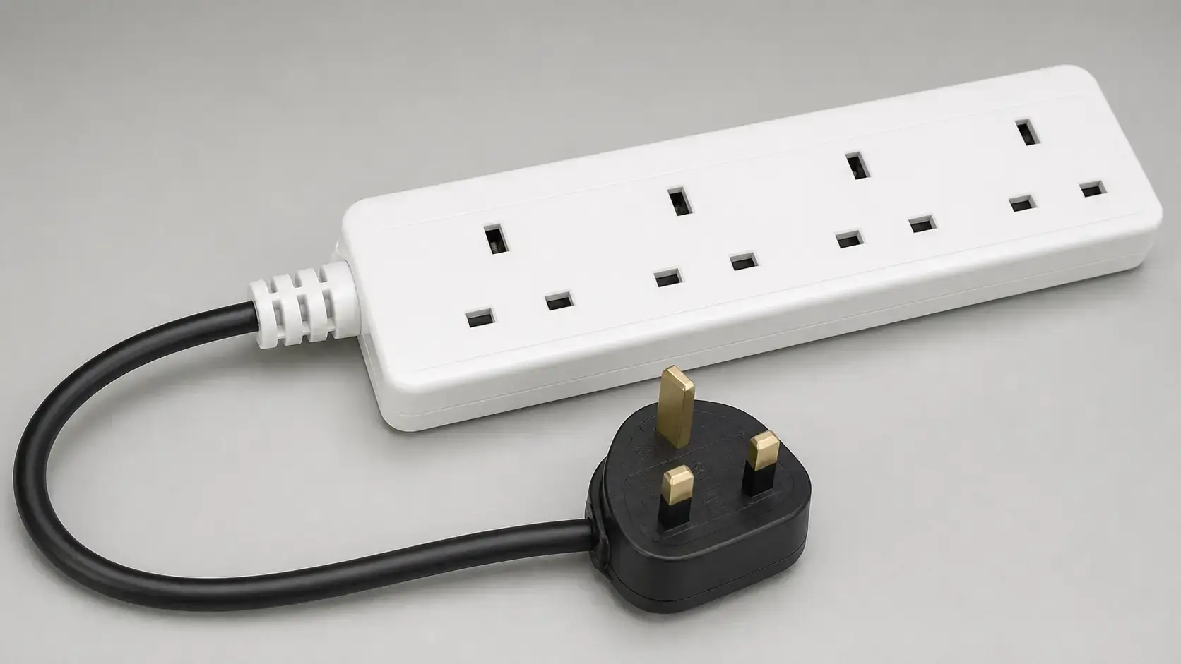 Closed four-socket UK extension lead showing molded cable strain relief and three-pin plug