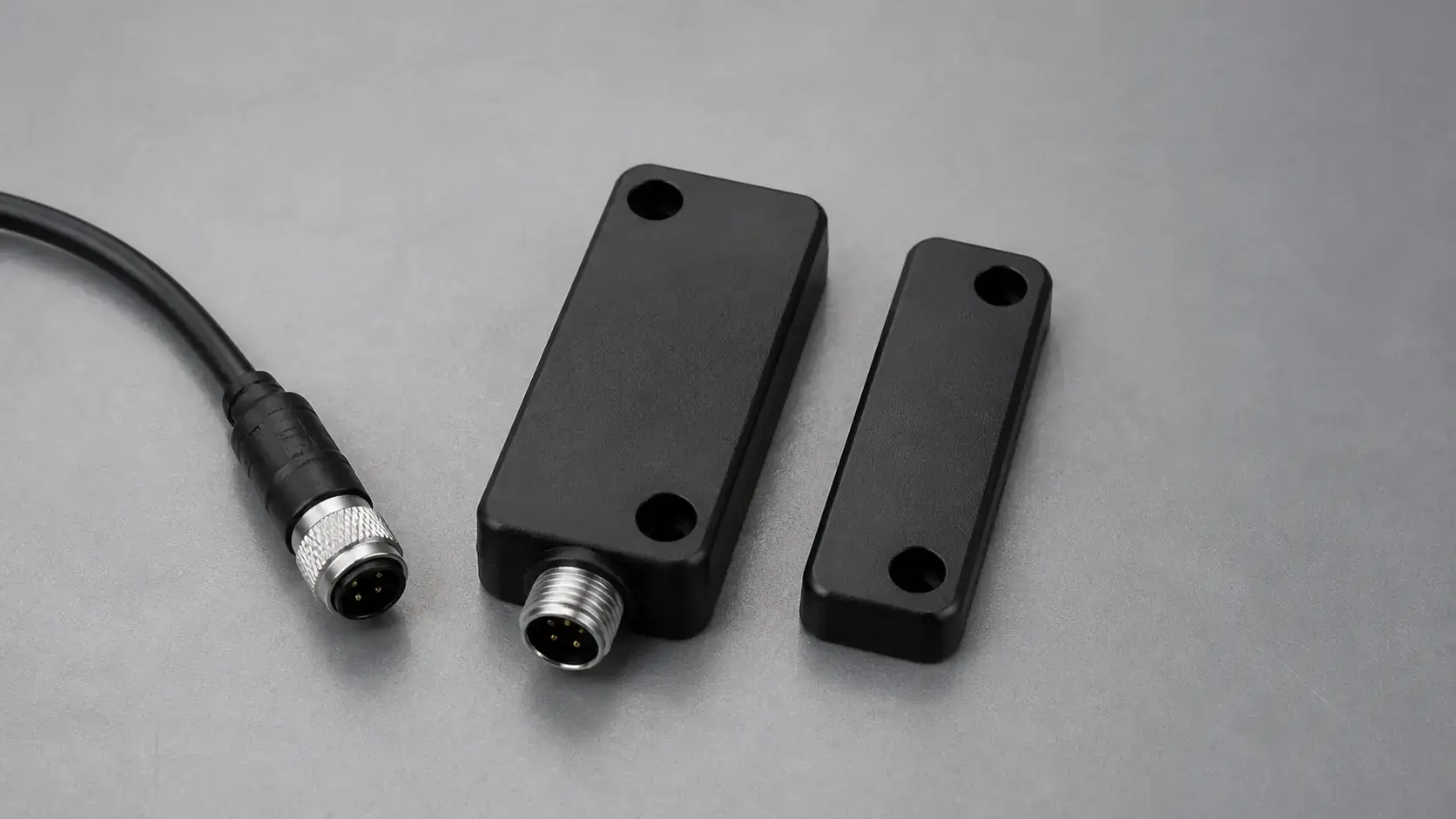 Non-contact guard interlock sensor and matching target shown as one PDDB application example